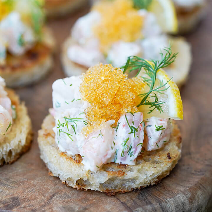 close up of a piece of toast Skagen topped with fish roe.